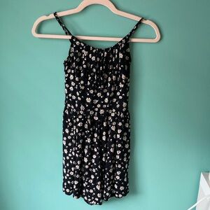 Black floral daisy pattern romper